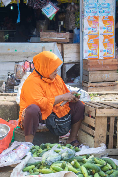a mother who is looking for a fortune selling vegetables in traditional markets or commonly called pandeglang markets stock photo