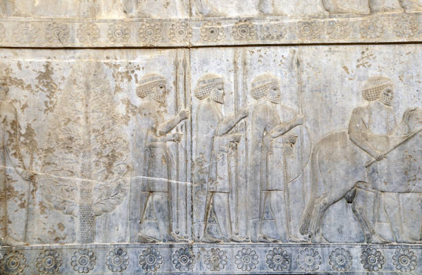 istock Ancient wall with bas-relief with assyrian warriors with spears, Persepolis, Iran 1428973742