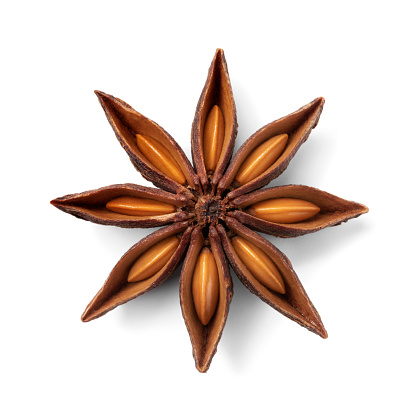 Single star anise and seed seen from above isolated on white background