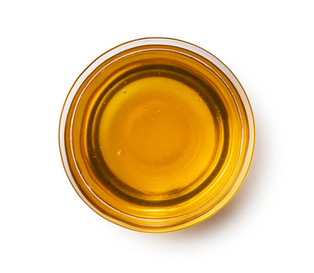 istock Honey in a glass container on a white background. 1428979764