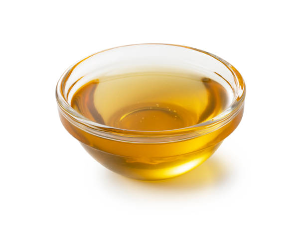 istock Honey in glass bowl on white background. 1428979840