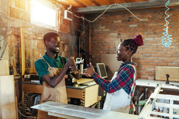 istock Two young Carpenters speak in sign language 1428988235