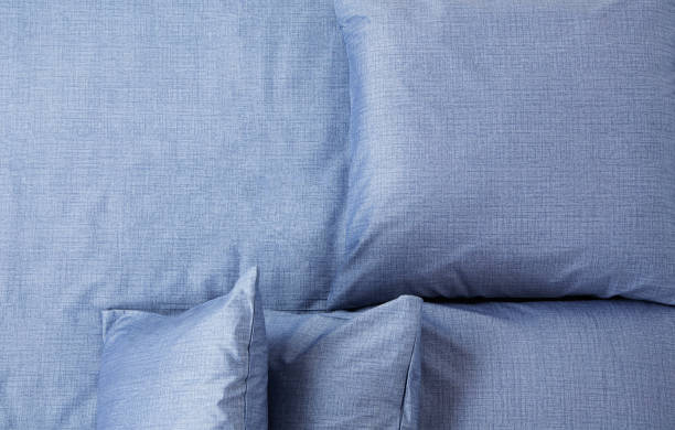istock blue bed linen laid out on the bed, top view 1428990304