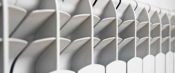 istock White heater on a light wall. Heating and heat concept. Banner 1428990335