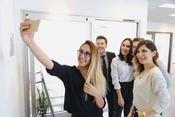 istock Young business people taking selfie after work 1428991971