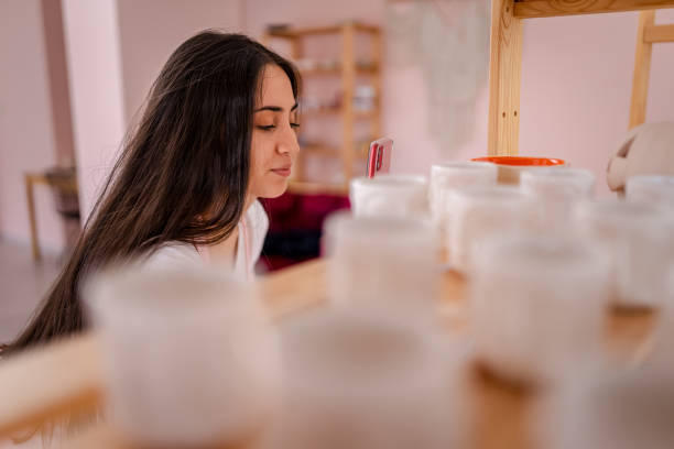 istock Beautiful woman working in pottery studio. 1428993988