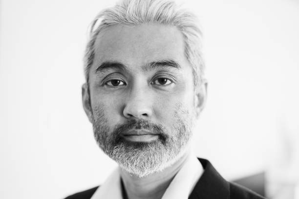 istock Business senior asian man looking at camera 1428995783