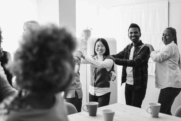istock Multiracial happy friends having fun dancing together in the kitchen 1428995882