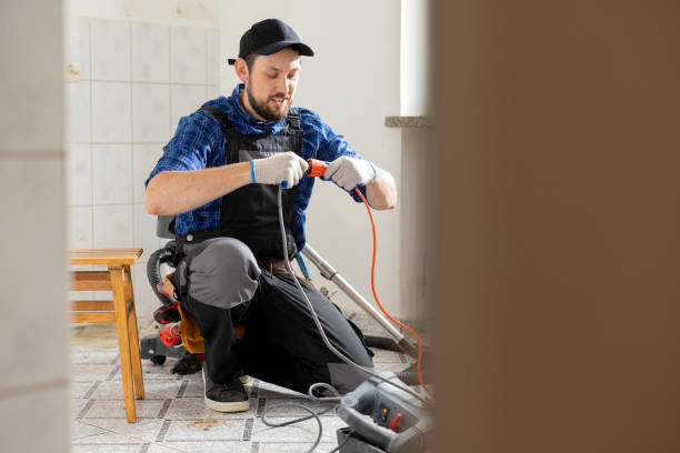 istock Connecting cables with a plug, extension cord plugging in construction equipment, breakdown, short circuit in house during renovation experienced man in field of electricity repairs electrical 1428996157
