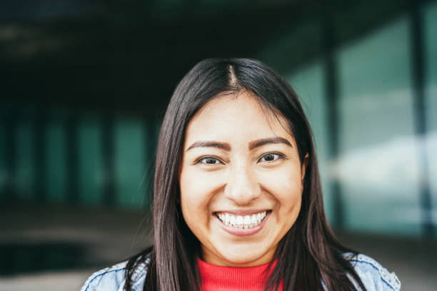 istock Happy latin woman smiling on camera 1428996296