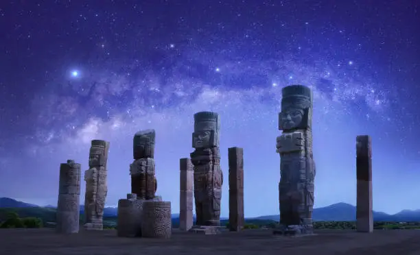 Photo of Toltec sculptures in Tula against background of starry sky, Mexico