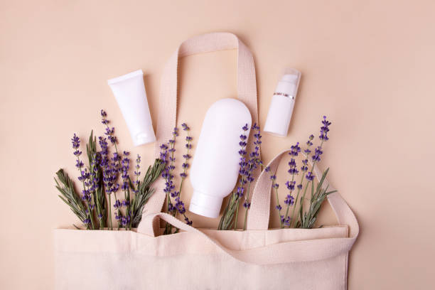 istock Open eco friendly cotton reusable bag with the different blank containers.Pastel colors.Natural lavender around.Concept of organic,zero waste cosmetics.Woman bag with accessories. 1428997760