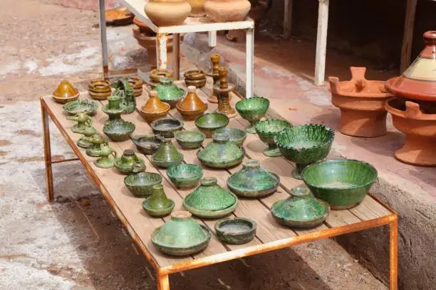 Ouarzazate street market artisanal products in Morocco. Moroccan handicraft ceramics in the souk. Tagine style ceramics.