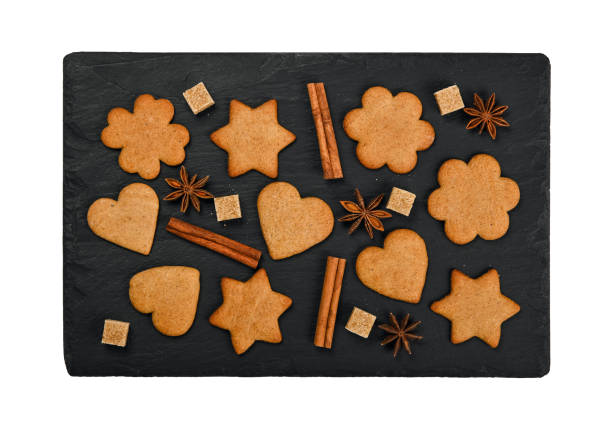 istock Gingerbread cookies and spices on black slate 1428998425