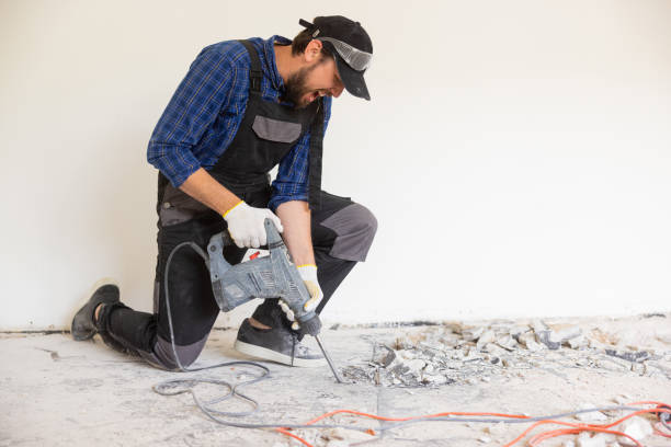 istock View of a construction worker using a hand-held demolition hammer and breaker to demolish walls to remove old floor tiles during renovation work 1429006071