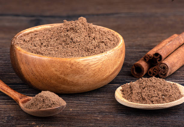 istock Cinnamon sticks and ground cinnamon in a bowl, on a spoon over a wooden background. 1429006123