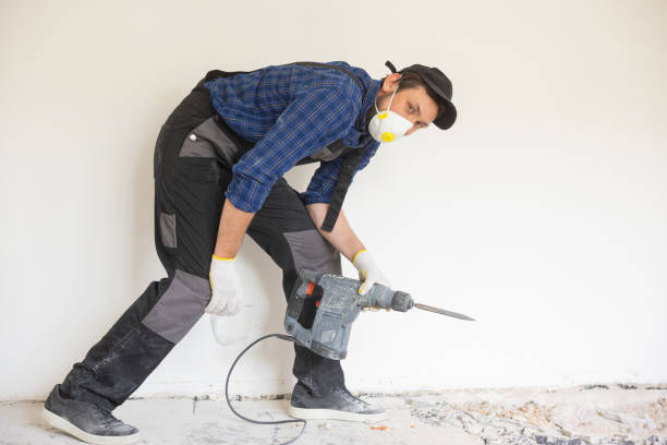 istock View of a construction worker using a hand-held demolition hammer and breaker to demolish walls to remove old floor tiles during renovation work 1429006187