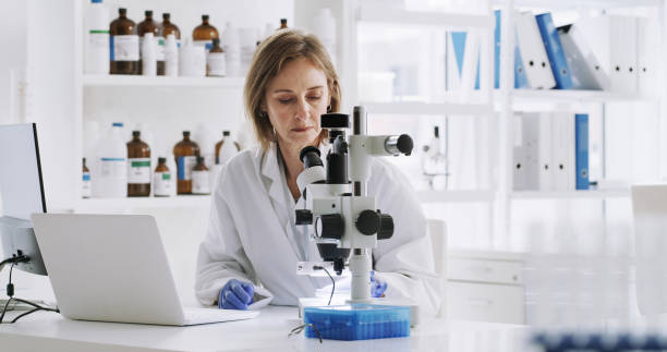 istock Microscope, science and scientist in research laboratory for vaccine, medical test and biotechnology development. Woman working on medical chemistry, chemical and forensic biology breakthrough alone 1429007658