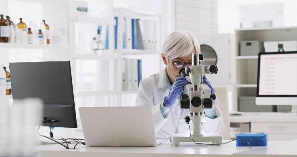 istock Science, microscope and research with a woman scientist working in a lab on innovation and development. Analytics, technology and experiment with a mature female expert working in her laboratory 1429007667