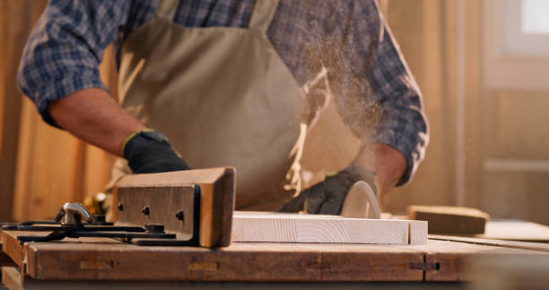 istock Male carpenter cutting wooden plank 1429008962