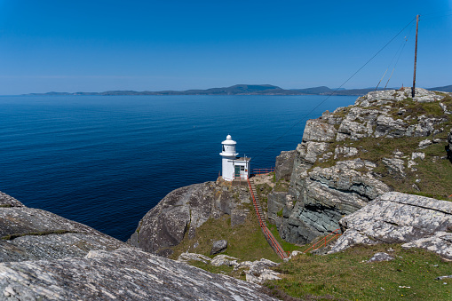 A view of the historic Sheep's Head Lighthouse on the Muntervary Peninsula in County Cork of Ireland