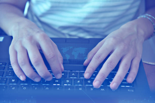 istock close up of a woman's hands working on laptop keyboard 1429011102