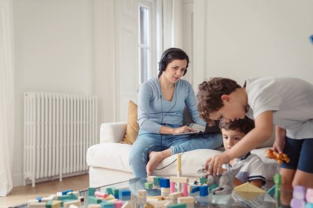 istock Mother trying to work from home 1429013253