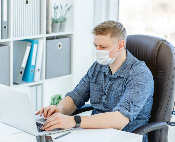 istock Man wearing medical face mask 1429014565