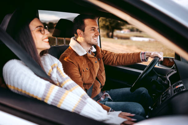 istock Happy young couple enjoying driving together 1429017083