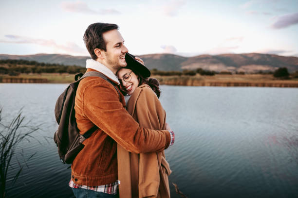 istock Young romantic couple standing on the pier 1429017326