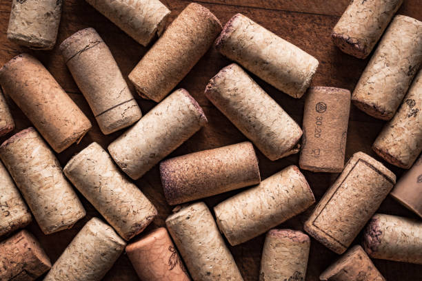 Wine cork stoppers background Wine cork stoppers background, top view, close up. Winery or wine tasting concept. cork stopper stock pictures, royalty-free photos & images