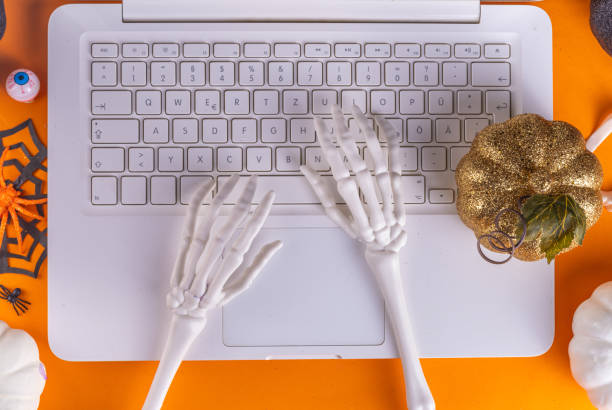 istock Halloween office laptop background 1429024756