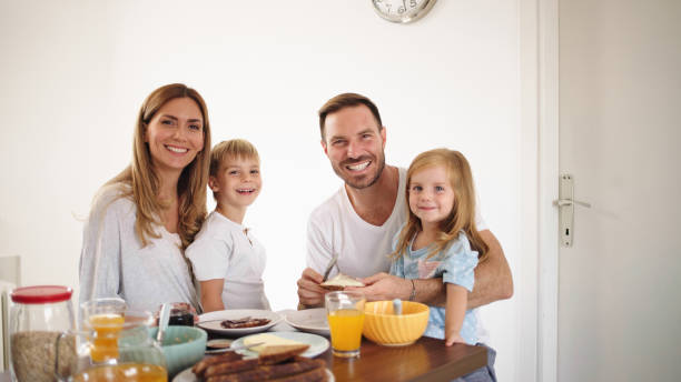 istock Parents with their kids in dining room having breakfast together 1429026796