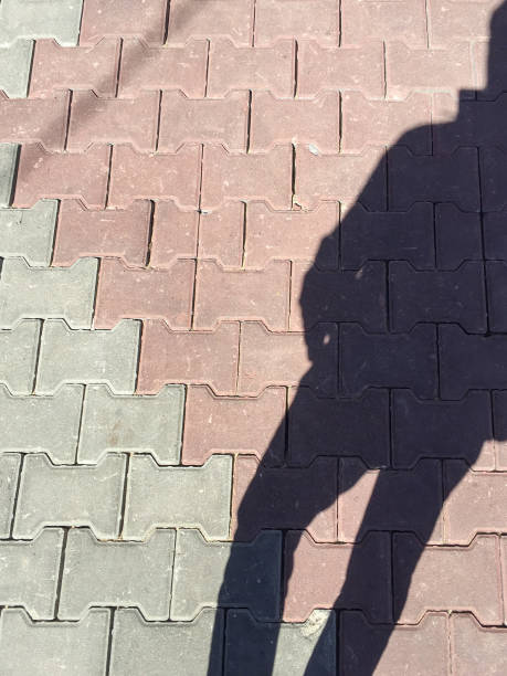 istock People shadow on the cobblestone flooring 1429027105