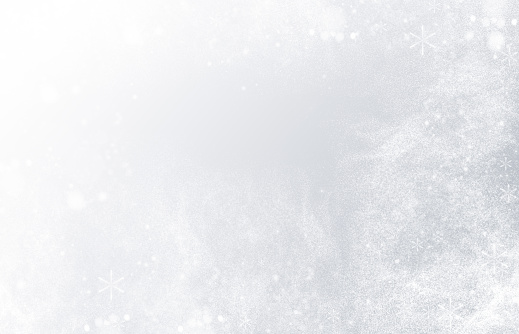 snowflakes and snow on gray background with copy space