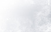 istock snowflakes and snow on gray background 1429027191