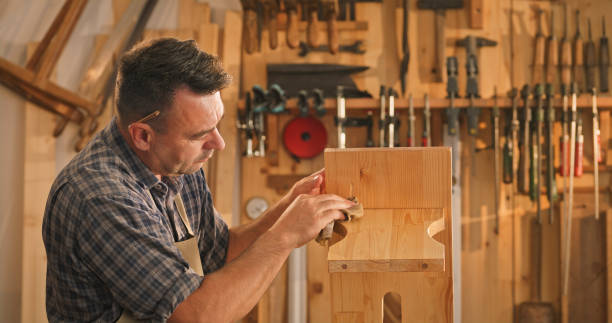 istock Male carpenter cleaning plank 1429028082