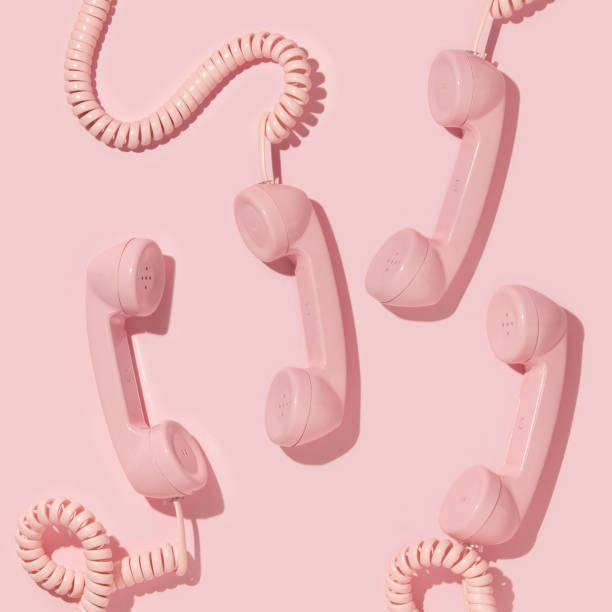 istock Creative layout with pink retro phone handsets on pastel pink background. 80s or 90s retro fashion aesthetic telephone concept. Minimal romantic handset idea. Valentines day idea. 1429028618