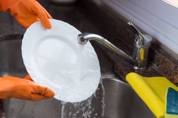 istock gloved hands washing a dish 1429028960