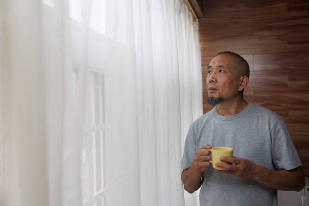 Middle aged men on the balcony and coffee
