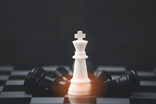 Business strategy competitive ideas concept with chess board game.Business competition, Fighting and confronting problems, threats from surrounding problems. Exhibited under the concept of games.