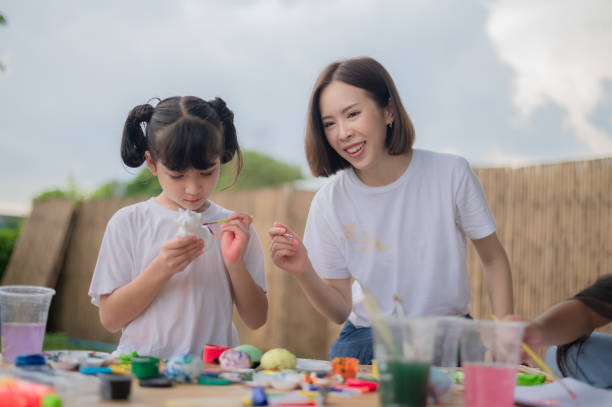 istock mother and daughter studying art draw a doll 1429052743