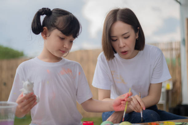 istock mother and daughter studying art draw a doll 1429052756