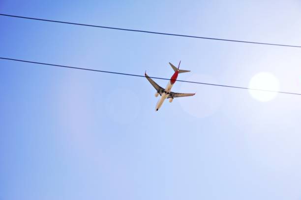 istock Airplane silhouette in the sky 1429053089