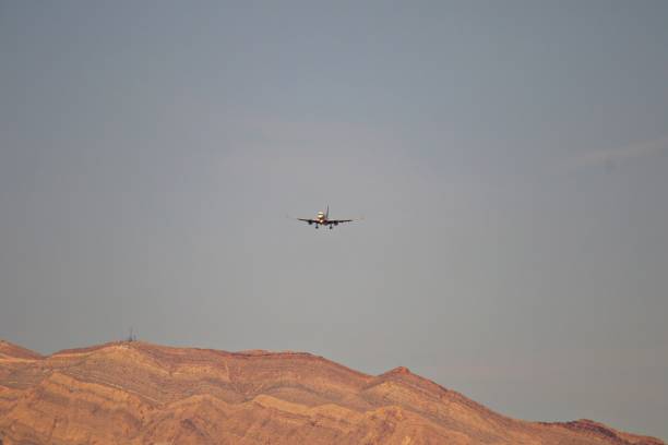 istock Airplane silhouette in the sky 1429053416
