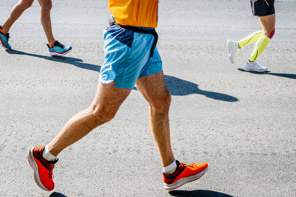 istock legs three runners run race on road 1429057195