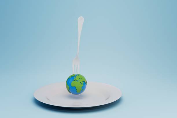 istock ecological resources of the planet. a plate with a planet pricked on a fork on a blue background. 3D render 1429058204