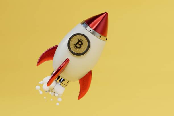 istock Bitcoin logo rocket launcher, cryptocurrency concept. rocket with bitcoin on a yellow background. 3d render 1429060889