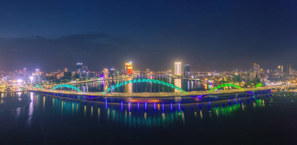 Drone view of Dragon bridge in Da Nang city in sunset by Tra river, Da Nang city, Quang Nam Da Nang province