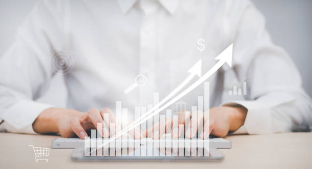 istock Business analytics and financial concept, Plans to increase business growth and an increase ,Technology and Business trend analysis concepts, with business graphs coming out on the computer notebook. 1429063424